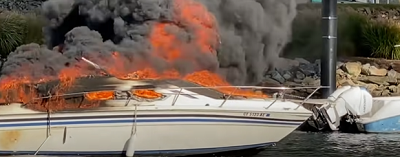 What should you do if the motor on your boat catches fire